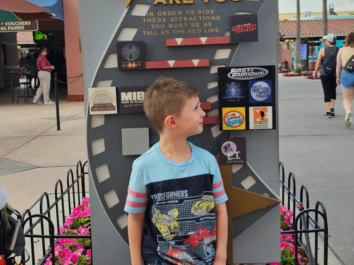 Marvel themed amusement park attraction board at Disney California Adventure Park, featuring Marvel superhero rides and shows.